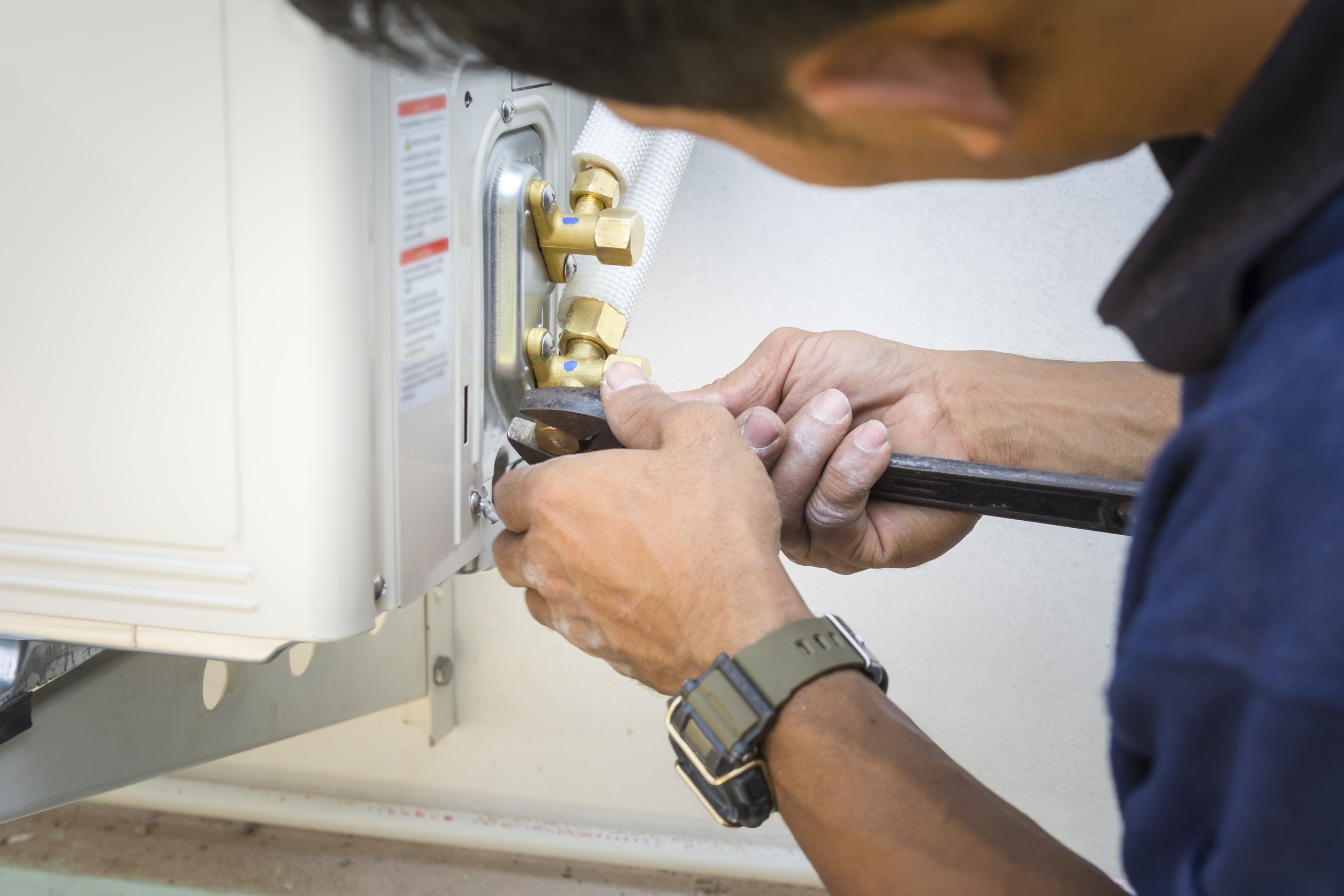 A technician installing air conditioner